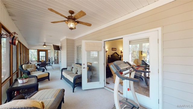 sunroom featuring french doors and ceiling fan