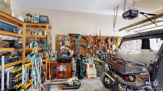 garage featuring a workshop area and a garage door opener