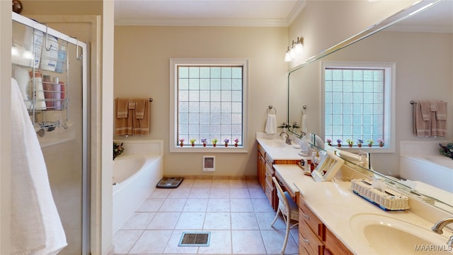 bathroom featuring tile patterned floors, vanity, separate shower and tub, and crown molding