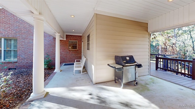 view of patio with a porch and a grill