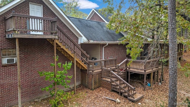 back of house with a wooden deck