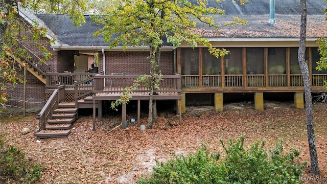 back of house with a sunroom