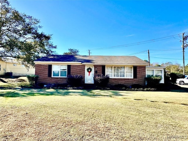 ranch-style house with a front yard