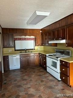 kitchen featuring dark brown cabinetry, white appliances, and sink