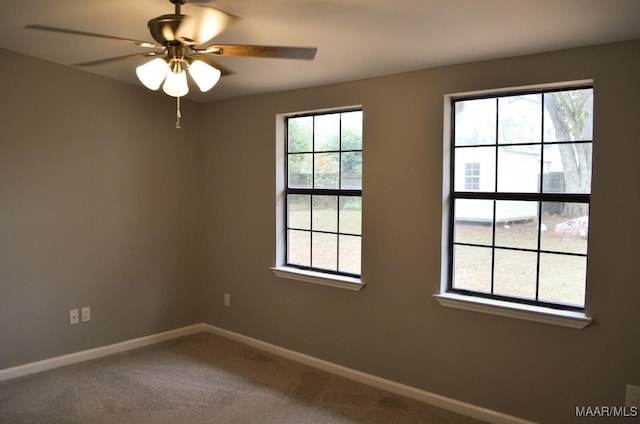 carpeted empty room with ceiling fan