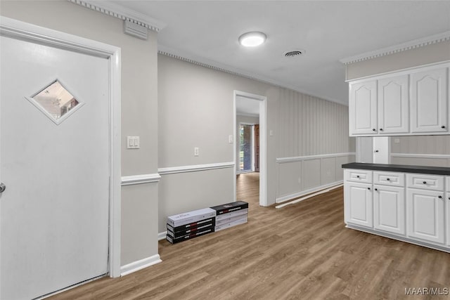 kitchen featuring white cabinetry and light hardwood / wood-style flooring