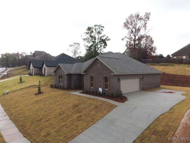 view of front facade with a garage and a front yard