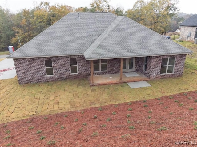 rear view of house featuring a patio