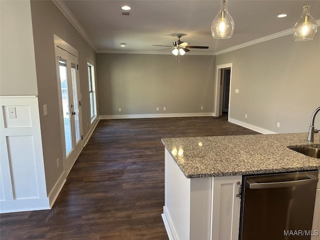 kitchen with a sink, light stone counters, dishwasher, and ornamental molding