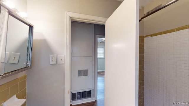 bathroom with wood-type flooring