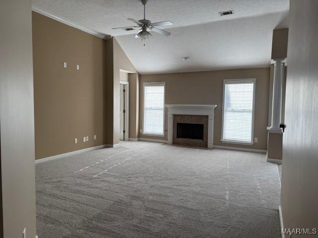 unfurnished living room featuring light carpet, crown molding, vaulted ceiling, ceiling fan, and a textured ceiling