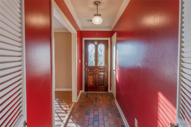 doorway to outside with ornamental molding