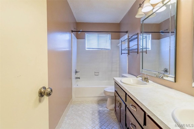 full bathroom with tiled shower / bath combo, toilet, and vanity