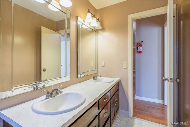 bathroom with hardwood / wood-style floors and vanity