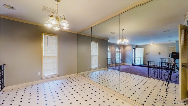 unfurnished dining area with crown molding, light carpet, and a chandelier