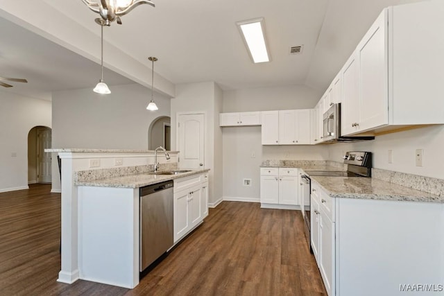 kitchen featuring pendant lighting, white cabinets, sink, dark hardwood / wood-style floors, and stainless steel appliances