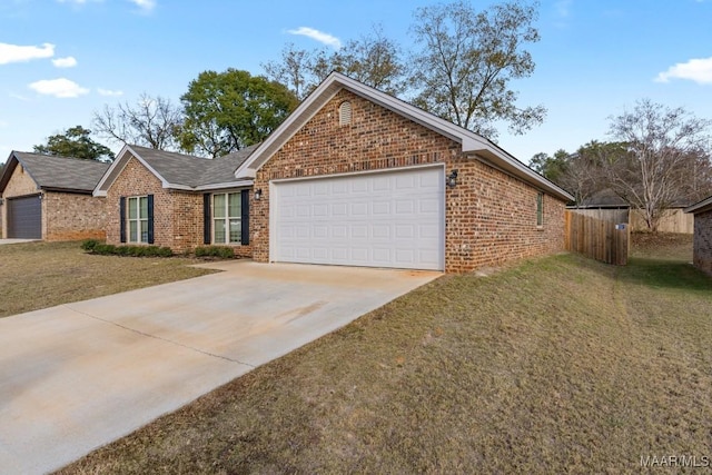 view of front of home featuring a front yard and a garage