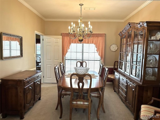 dining space with crown molding, plenty of natural light, and a notable chandelier