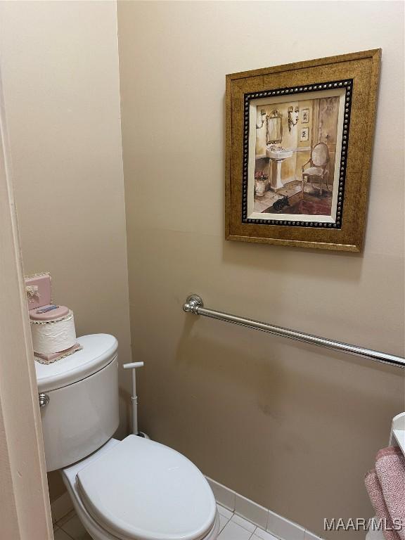 bathroom with tile patterned floors and toilet