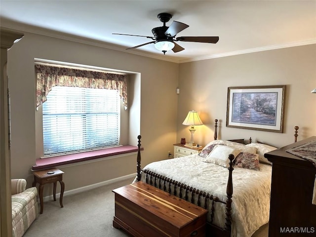 bedroom with ceiling fan, crown molding, and carpet