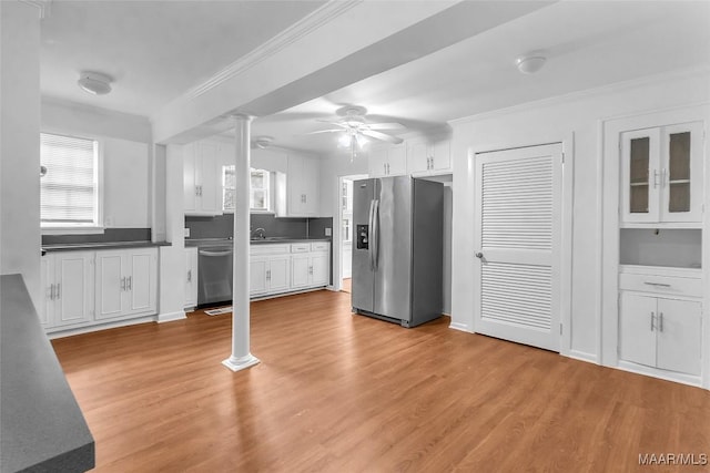 kitchen featuring light hardwood / wood-style flooring, white cabinets, and appliances with stainless steel finishes