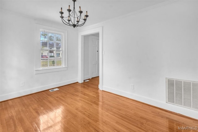 unfurnished dining area featuring light hardwood / wood-style floors and an inviting chandelier