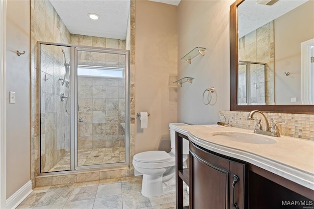 bathroom featuring decorative backsplash, vanity, toilet, and an enclosed shower