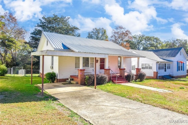 view of front of property with a porch and a front yard