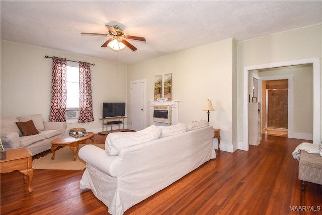 living room featuring ceiling fan, cooling unit, and dark hardwood / wood-style floors