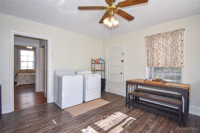 laundry room featuring crown molding, separate washer and dryer, and dark wood-type flooring