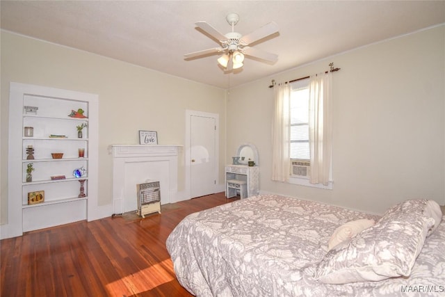 bedroom with dark hardwood / wood-style floors and ceiling fan