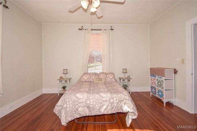 bedroom with dark hardwood / wood-style floors and ceiling fan