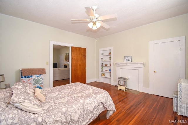 bedroom with dark hardwood / wood-style flooring and ceiling fan