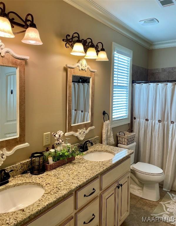 bathroom with vanity, crown molding, tile patterned flooring, a shower with shower curtain, and toilet