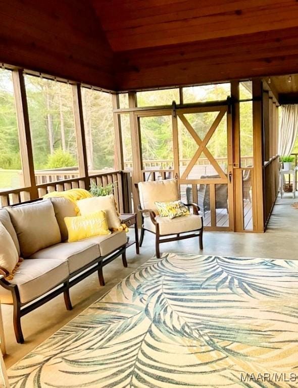 sunroom featuring wooden ceiling