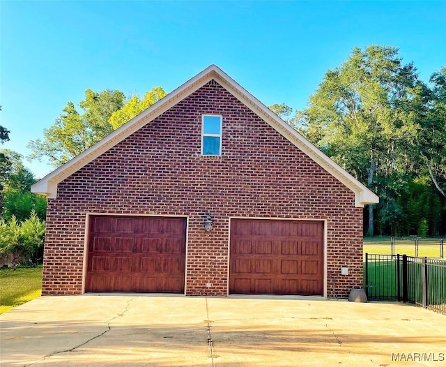 view of side of home featuring a garage