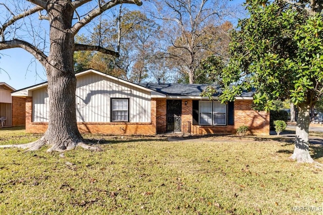 ranch-style house with a front lawn