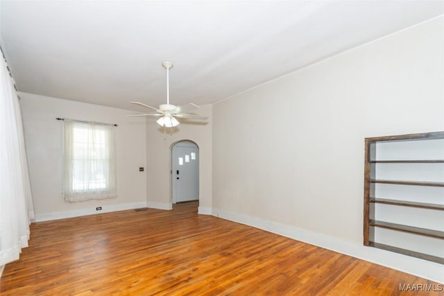 empty room featuring ceiling fan and light hardwood / wood-style floors