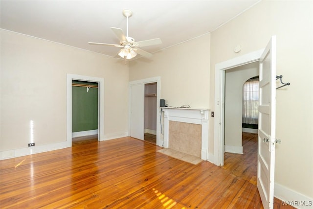 interior space featuring ceiling fan and wood-type flooring