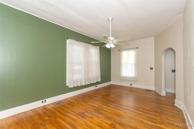 spare room with hardwood / wood-style floors and ceiling fan