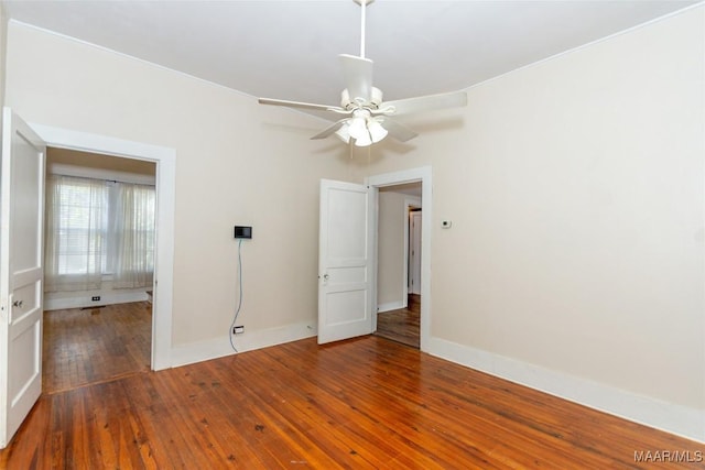 unfurnished room featuring ceiling fan and hardwood / wood-style flooring