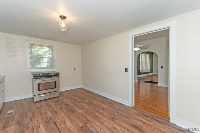 kitchen featuring ceiling fan, stainless steel range with electric cooktop, and dark hardwood / wood-style floors