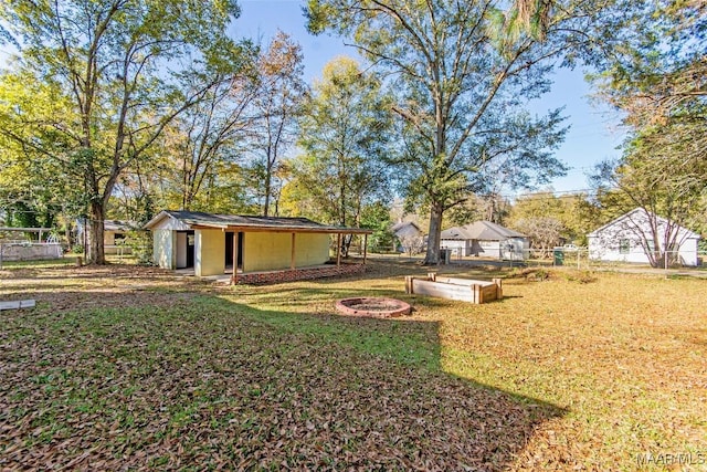 view of yard with an outdoor fire pit