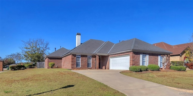 view of front of home featuring a front yard and a garage