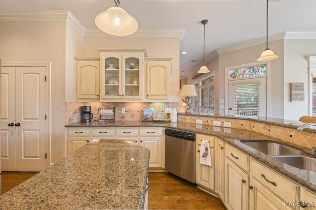 kitchen featuring dark wood-type flooring, stainless steel dishwasher, dark stone counters, and sink