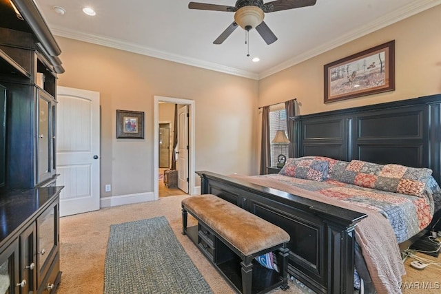 carpeted bedroom featuring ensuite bathroom, ceiling fan, and ornamental molding