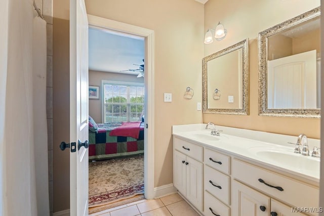 bathroom with tile patterned floors, ceiling fan, and vanity