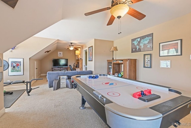 game room featuring light colored carpet, vaulted ceiling, and ceiling fan