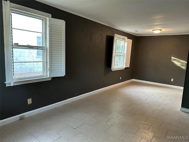 unfurnished room featuring crown molding