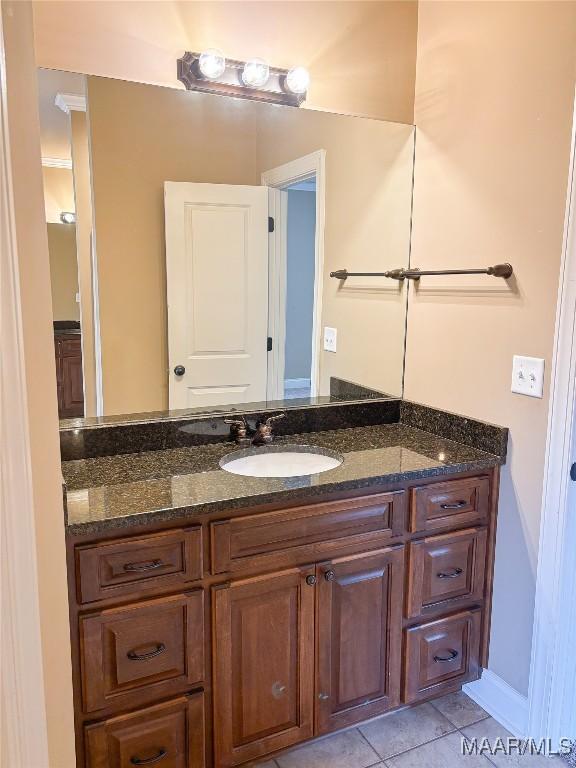 bathroom with tile patterned flooring and vanity